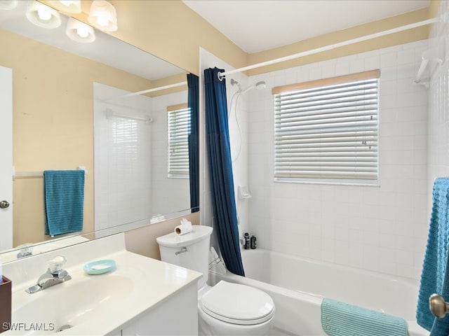 full bathroom with toilet, a healthy amount of sunlight, shower / bathtub combination with curtain, and vanity