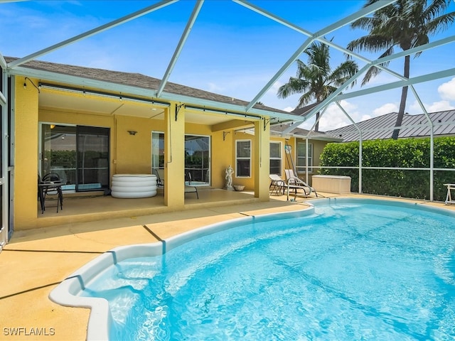 view of pool featuring a patio area and a lanai