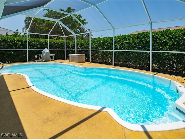 view of pool featuring a lanai