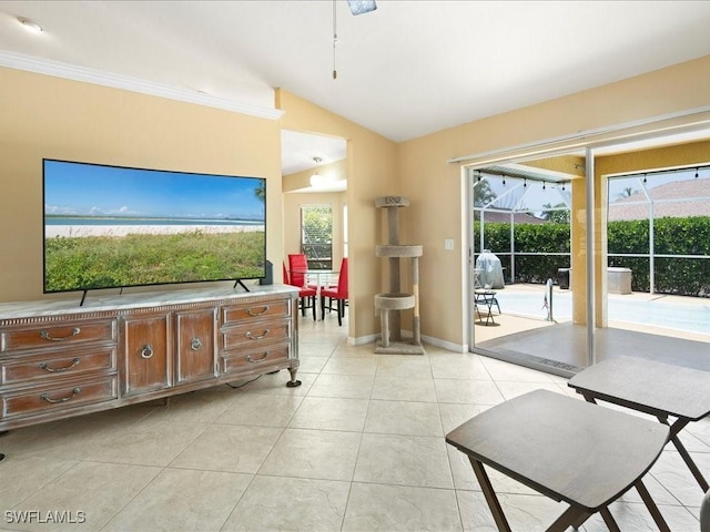 160 Kirkwood St, Marco Island, FL 34145 - living room with crown molding, baseboards, light tile patterned floors, and lofted ceiling