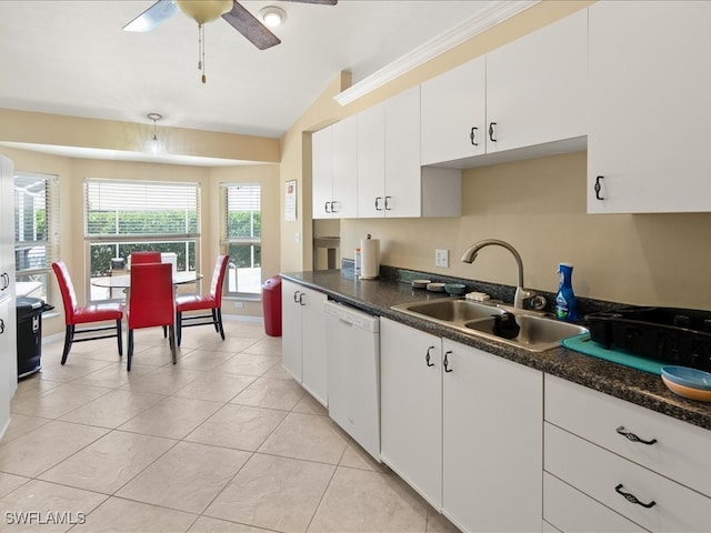 kitchen featuring white cabinets, sink, white dishwasher, and vaulted ceiling