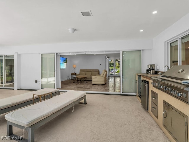living room featuring visible vents and recessed lighting