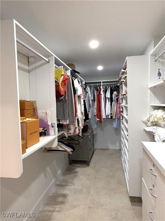 walk in closet featuring light tile patterned floors