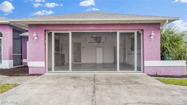 property entrance featuring a patio