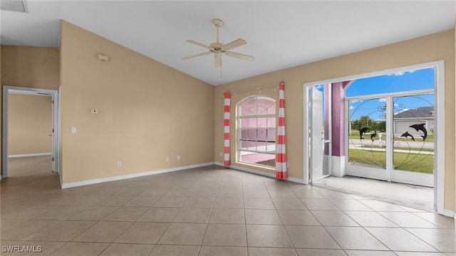 tiled empty room featuring vaulted ceiling and ceiling fan