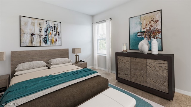 bedroom featuring carpet and baseboards