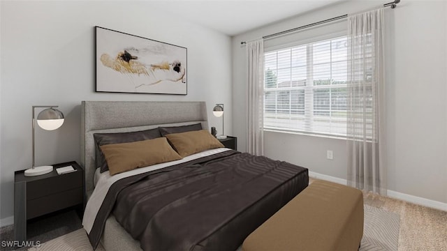 bedroom with carpet and baseboards