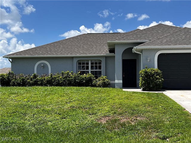 single story home with a front lawn and a garage