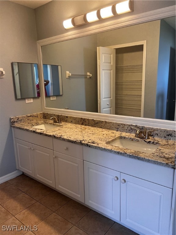 bathroom with tile patterned floors and vanity