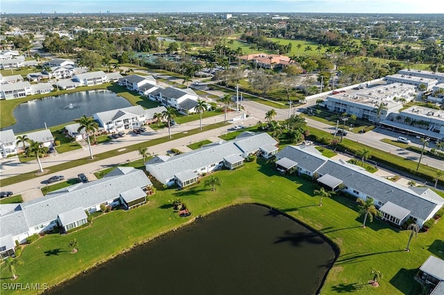 bird's eye view featuring a water view and a residential view