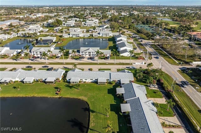 birds eye view of property featuring a water view and a residential view