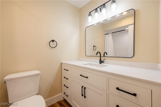 bathroom with vanity, wood-type flooring, a shower with shower curtain, and toilet