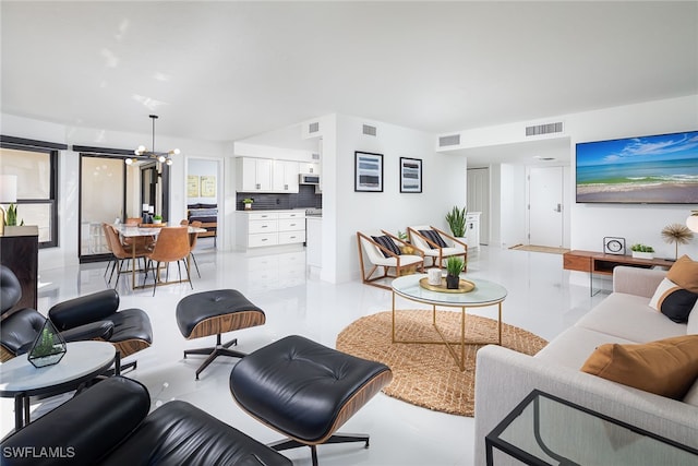 living room with an inviting chandelier