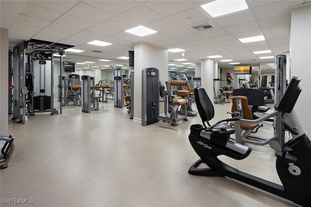 exercise room with a paneled ceiling