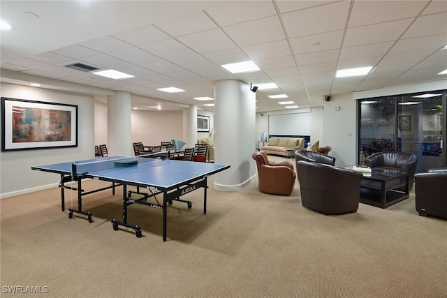 playroom featuring carpet flooring and a paneled ceiling