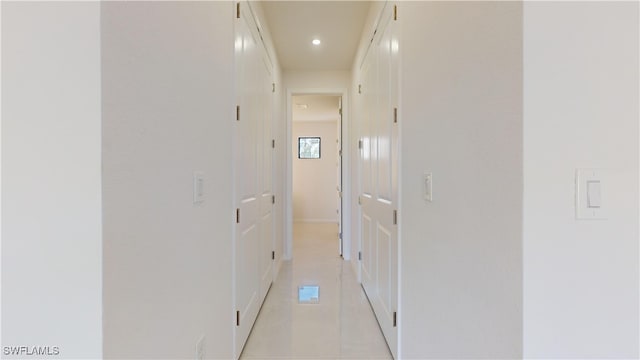 hallway featuring light tile patterned floors