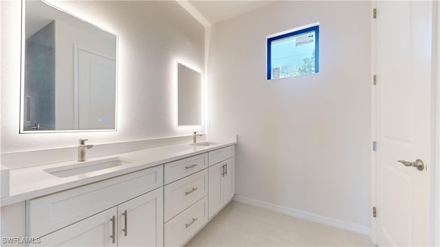 bathroom with vanity and tile patterned floors