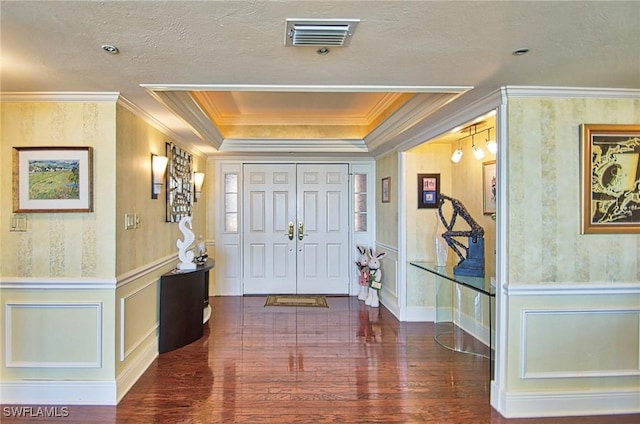 4031 Gulf Shore Blvd N Unit 8E, Naples, FL 34103 - foyer entrance featuring crown molding, a decorative wall, wood finished floors, and visible vents