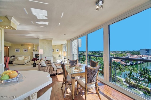 4031 Gulf Shore Blvd N Unit 8E, Naples, FL 34103 - sunroom / solarium featuring floor to ceiling windows and wood finished floors