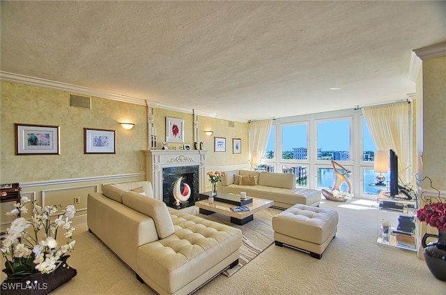 living room with crown molding, light carpet, and a textured ceiling