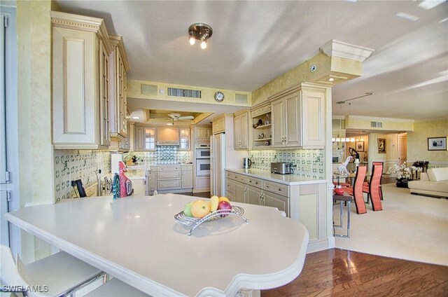 4031 Gulf Shore Blvd N Unit 8E, Naples, FL 34103 - kitchen with light countertops, visible vents, decorative backsplash, and white appliances