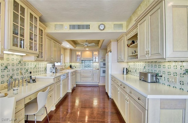 4031 Gulf Shore Blvd N Unit 8E, Naples, FL 34103 - kitchen featuring visible vents, a ceiling fan, dark wood-style floors, a tray ceiling, and a sink