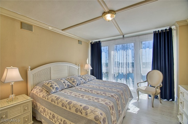 bedroom featuring crown molding and light hardwood / wood-style flooring