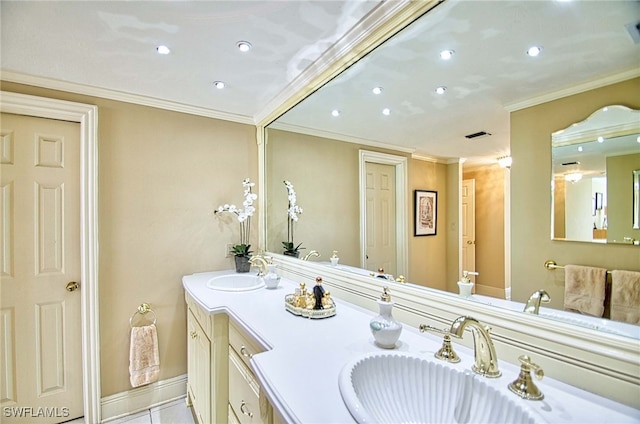 bathroom with vanity, ornamental molding, and tile patterned floors