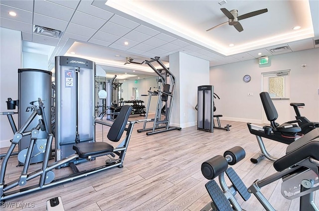 4031 Gulf Shore Blvd N Unit 8E, Naples, FL 34103 - gym featuring a tray ceiling, visible vents, ceiling fan, and wood finished floors