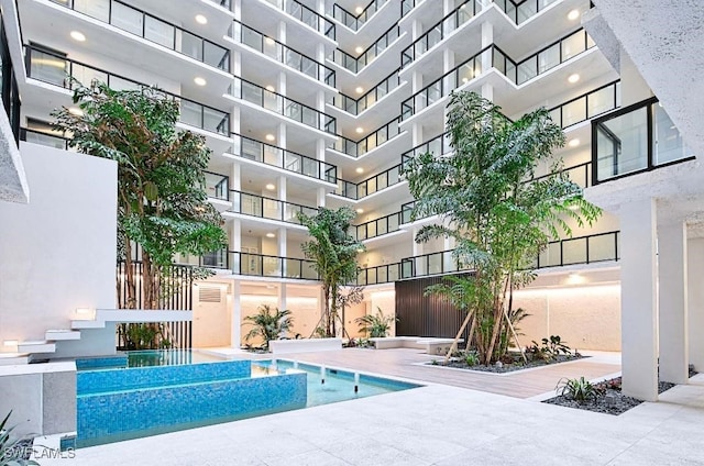 view of swimming pool featuring a patio area