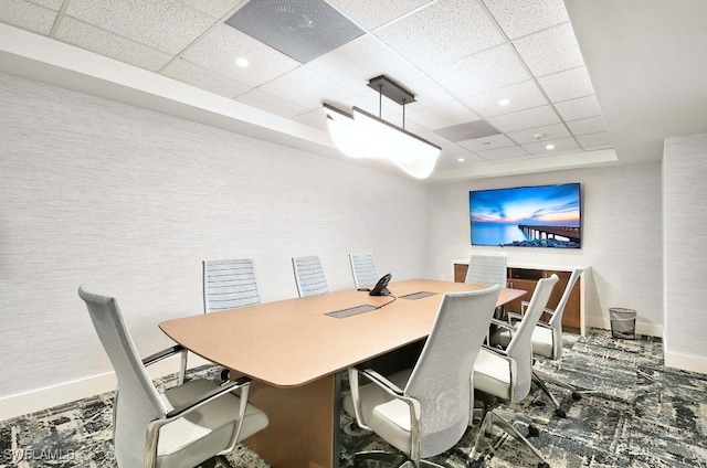 dining room featuring a drop ceiling