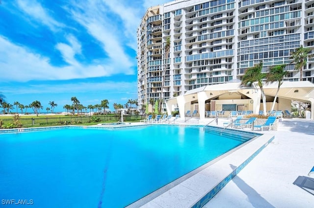 view of swimming pool featuring a patio area