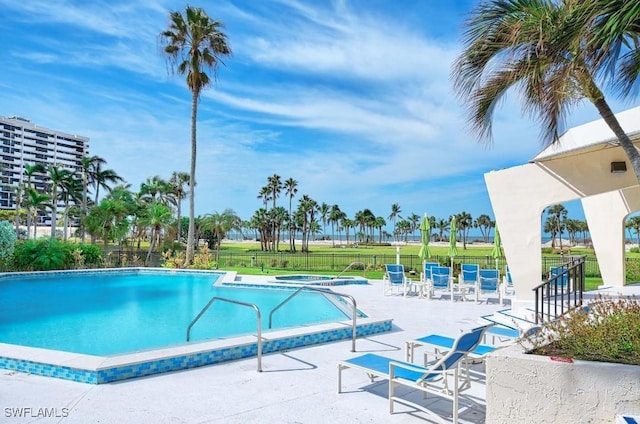 4031 Gulf Shore Blvd N Unit 8E, Naples, FL 34103 - community pool with fence and a patio