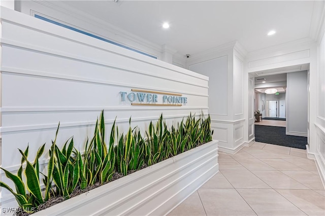 hall featuring ornamental molding, recessed lighting, and light tile patterned flooring
