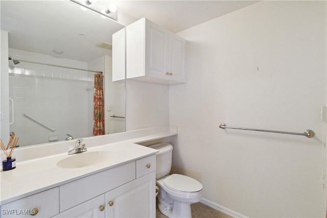 bathroom with vanity, toilet, curtained shower, and tile patterned flooring