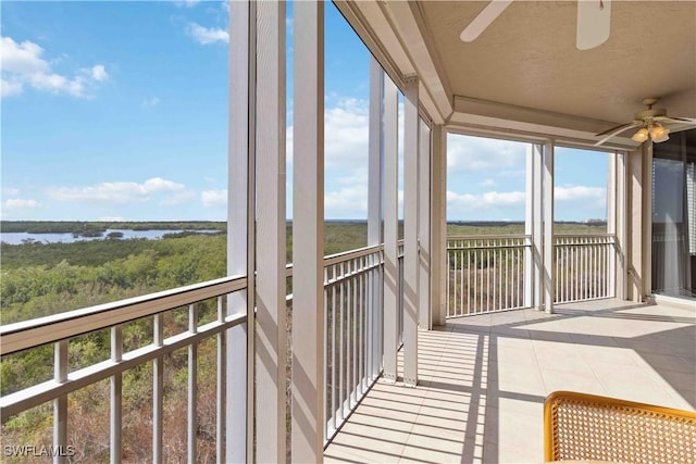 unfurnished sunroom featuring a water view