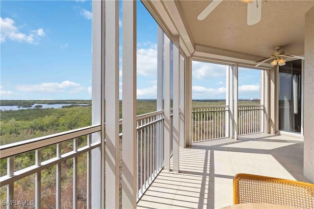 unfurnished sunroom with plenty of natural light and a water view