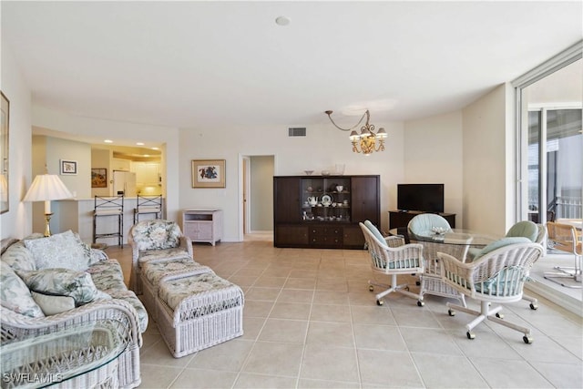 tiled living room with a chandelier