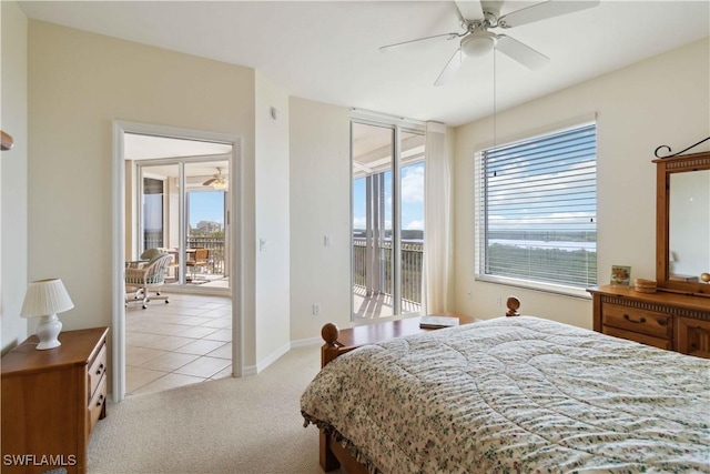 carpeted bedroom featuring ceiling fan, multiple windows, and access to outside