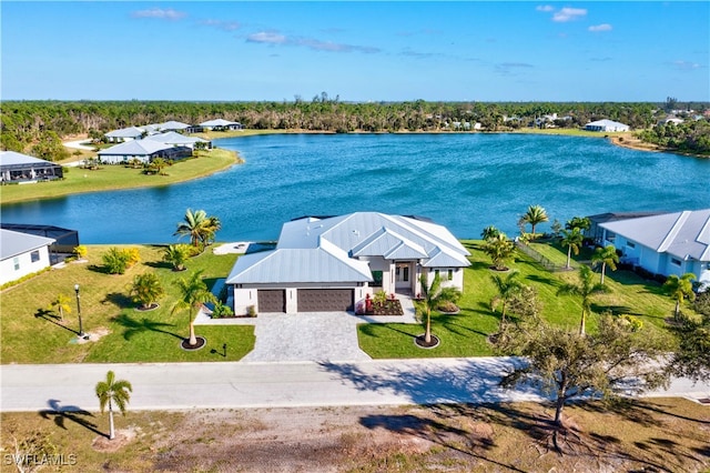 birds eye view of property with a water view