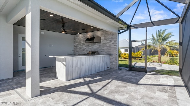 view of patio / terrace featuring ceiling fan and a lanai