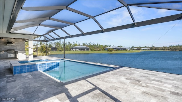 view of pool featuring a patio area, a water view, and a lanai