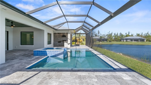 view of swimming pool with ceiling fan, a lanai, a patio area, an in ground hot tub, and a water view