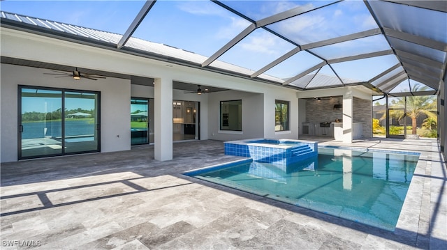 view of pool with an in ground hot tub, ceiling fan, a lanai, and a patio area