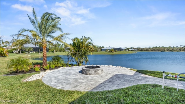 view of patio featuring a water view and a fire pit