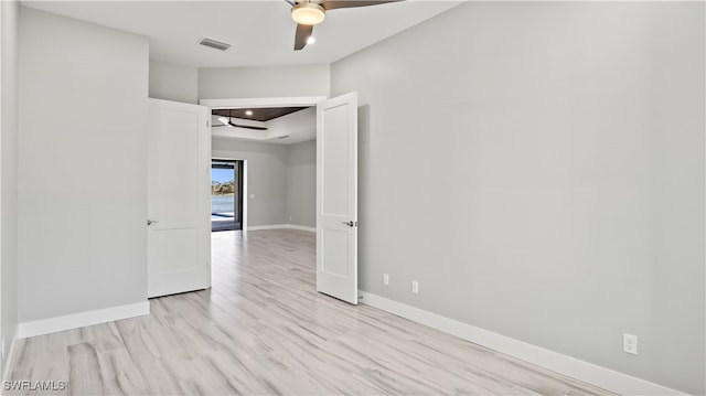 empty room with light hardwood / wood-style floors and ceiling fan