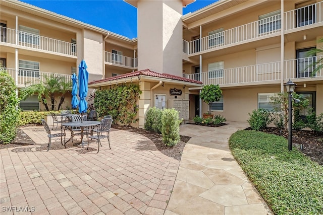 view of patio with a balcony