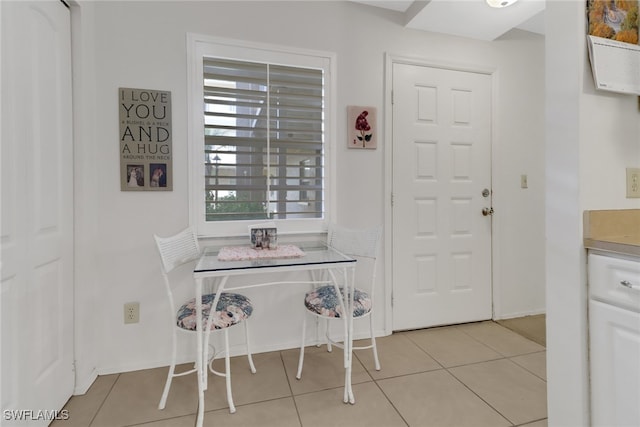 dining space featuring light tile patterned floors