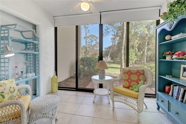 sunroom featuring ceiling fan and a wealth of natural light