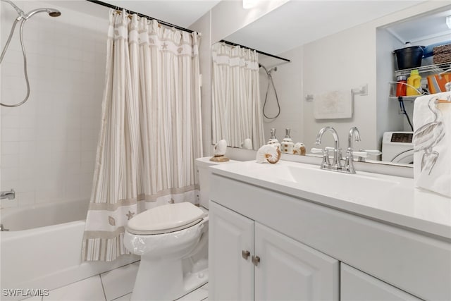 full bathroom with washer / dryer, shower / bath combination with curtain, toilet, vanity, and tile patterned flooring